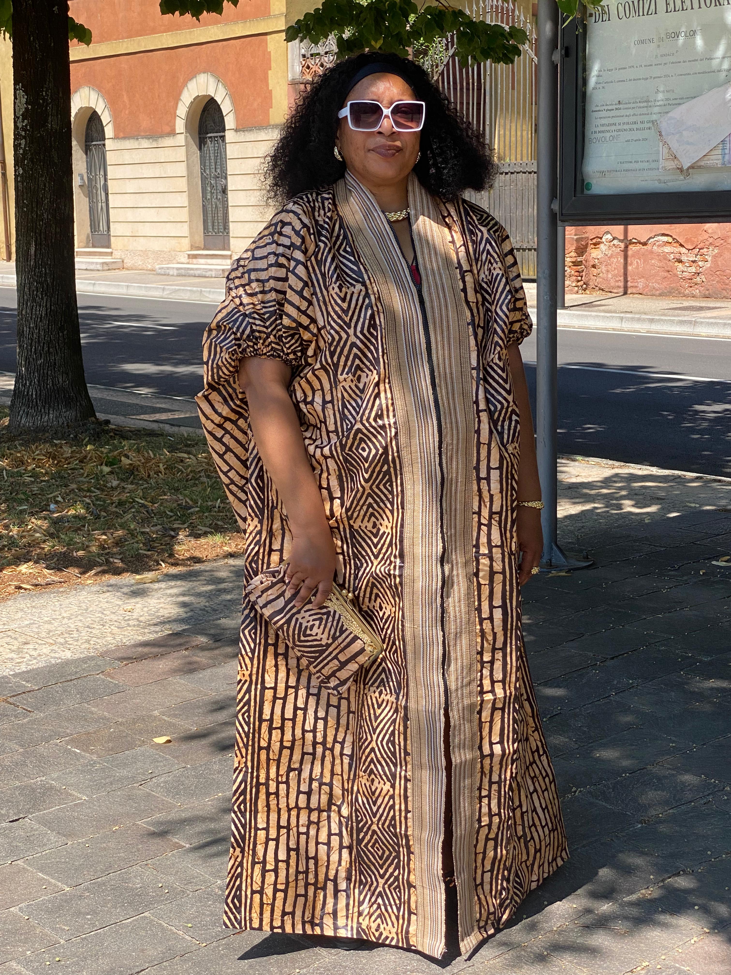 Brown and black Adire bubu gown designed with ashoke and its bag